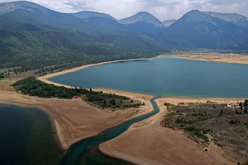 Twin Lakes, Colorado from the air — a turquoise channel between sandbars, the Sawatch Range behind
