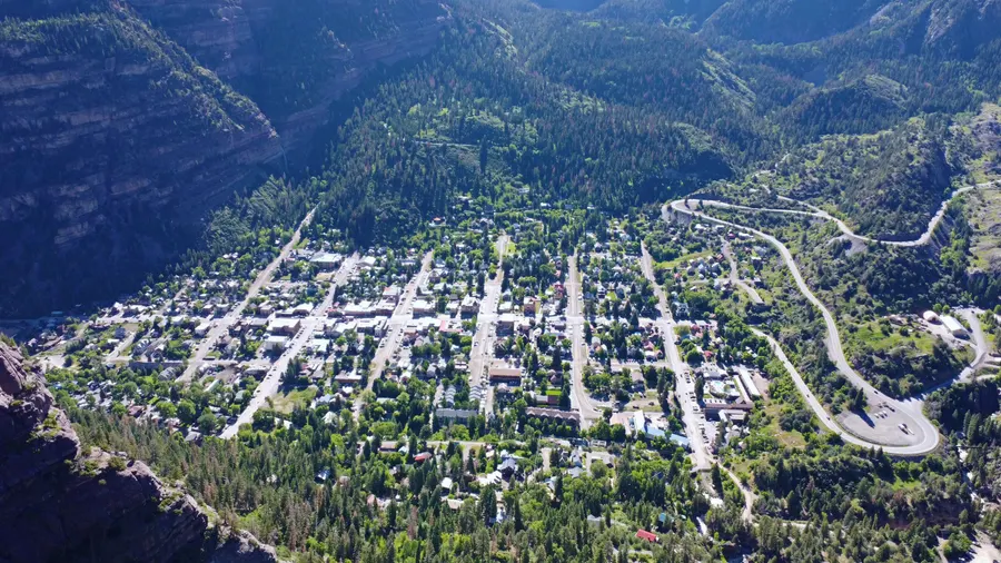 Aerial of Ouray, Colorado — the town grid boxed in by canyon walls