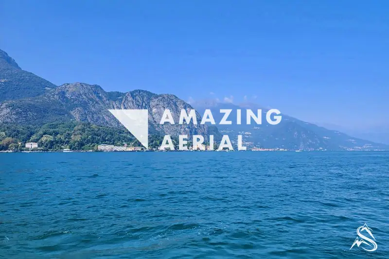 A Lake Como village climbing the wooded mountainside across the water from Bellagio