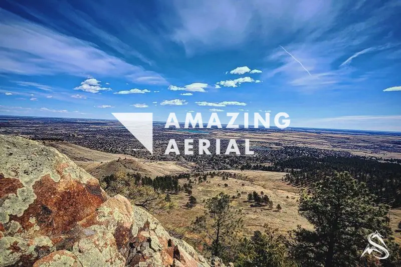The plains stretching east from a rocky Flatiron ledge above Boulder