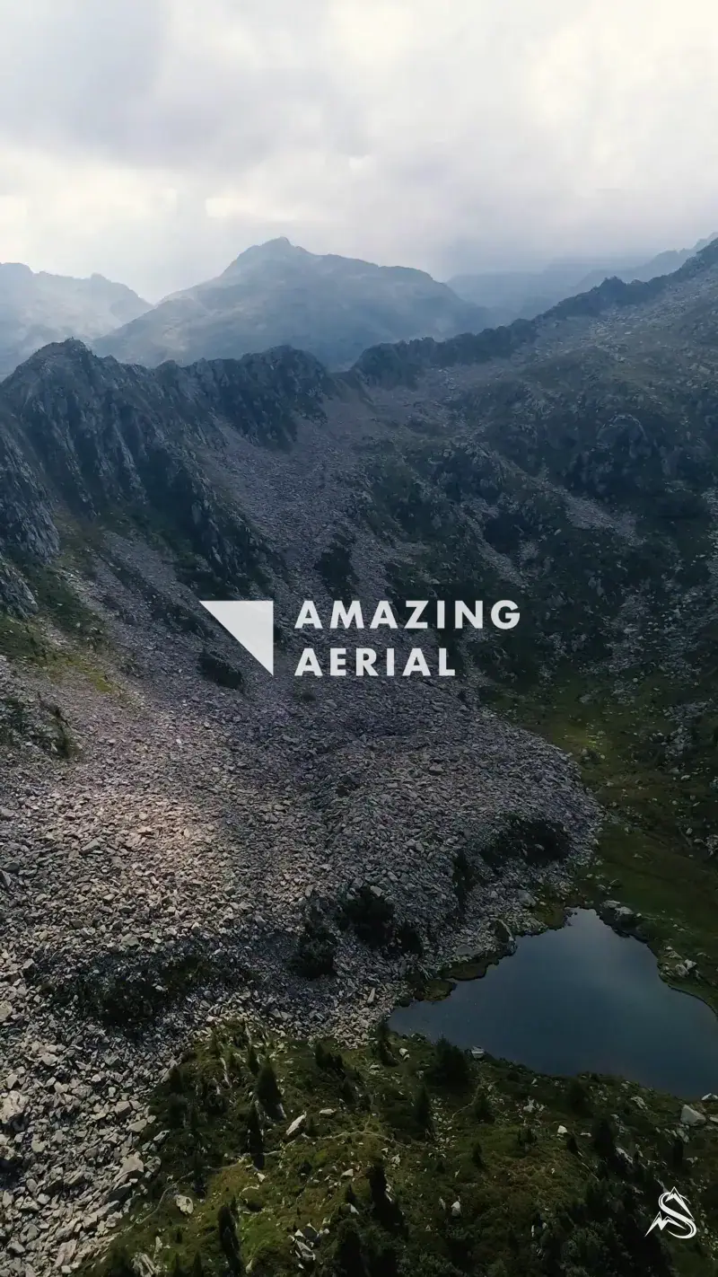 High alpine tarns held in rock basins below grey scree slopes above Madonna di Campiglio