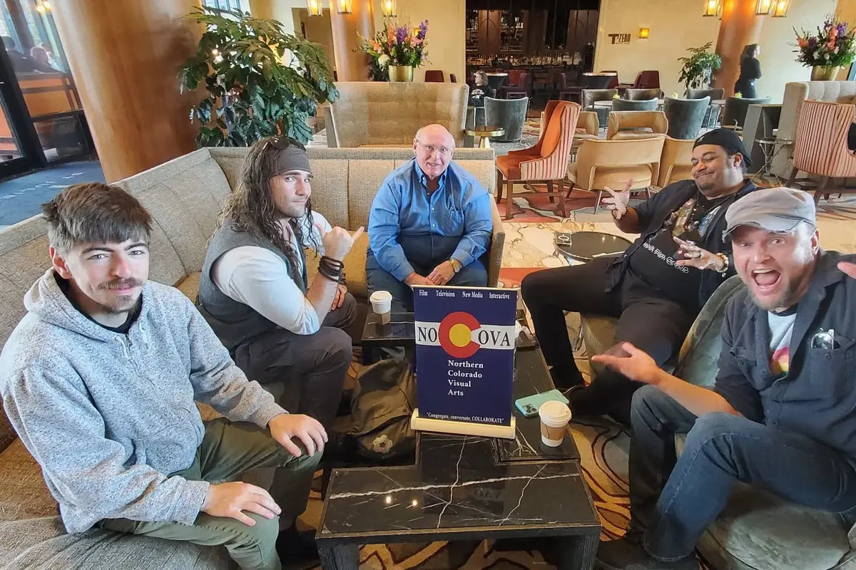Members gathered around a table at a NOCOVA meetup.