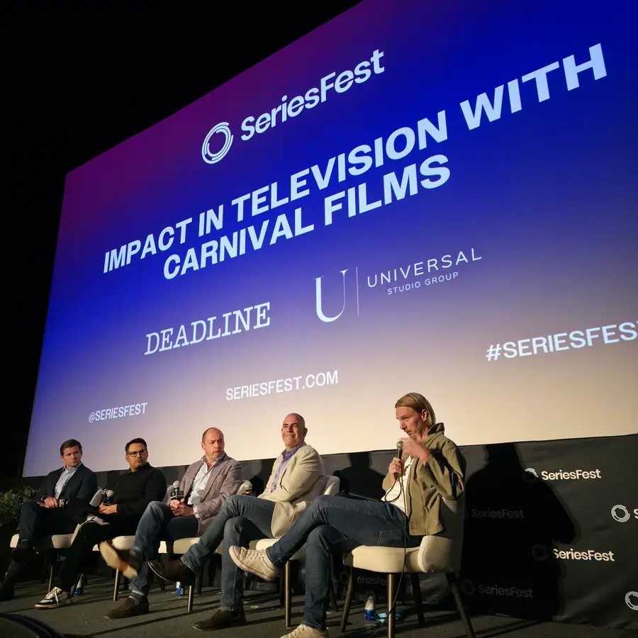 A row of panelists on stage beneath a screen reading “Impact in Television with Carnival Films,” with the Deadline and Universal Studio Group marks.