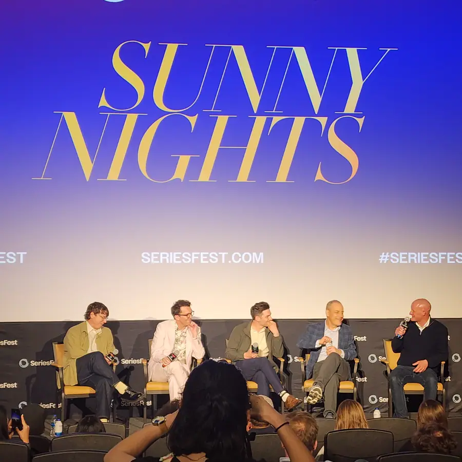 Five panelists seated across the SeriesFest stage under a screen reading “Sunny Nights.”